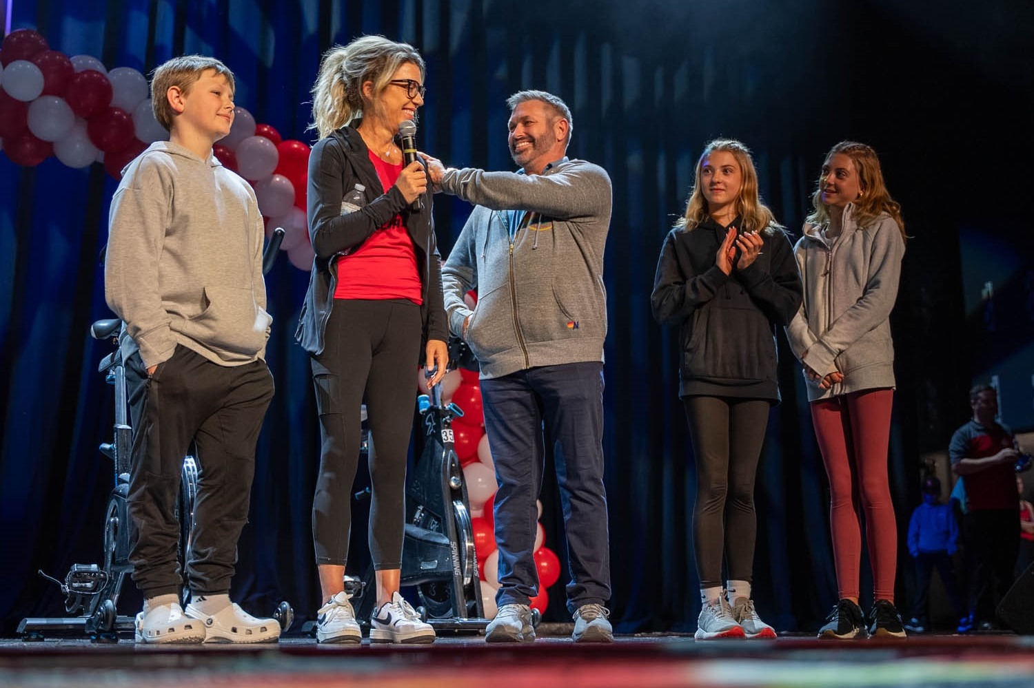 Family of 5 on stage at CycleNation event