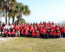 group picture of participants in red shirts