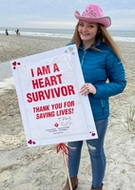 I am a Heart Survivor-teen holding sign