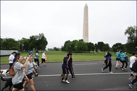 Runners-Walkers along the route with Washington monument