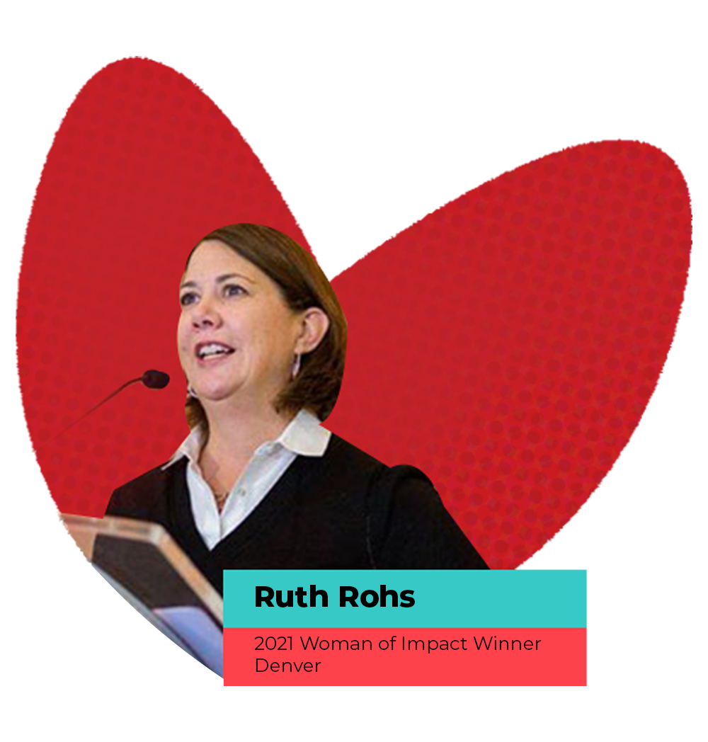 Ruth Rohs, 2021 Woman of Impact Winner, Denver standing at speaker podium.
